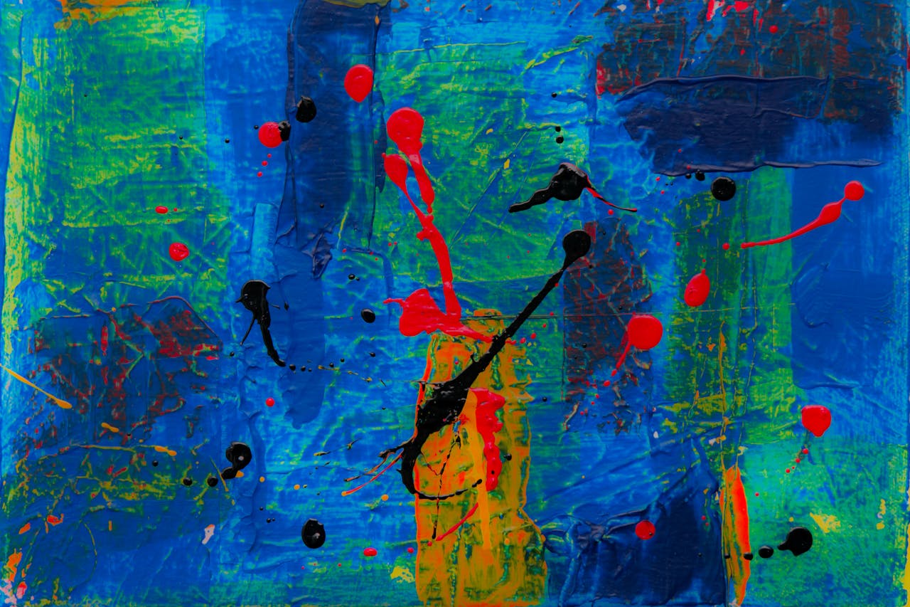 Dynamic abstract expressionist painting featuring vibrant blue, red, and green colors.