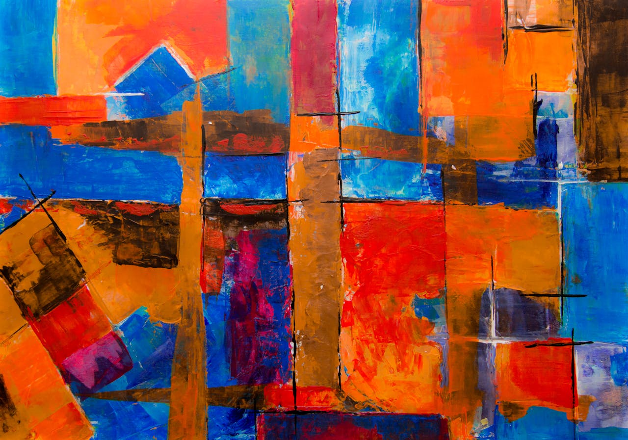 Dynamic abstract painting with bold colors and geometric shapes on canvas.